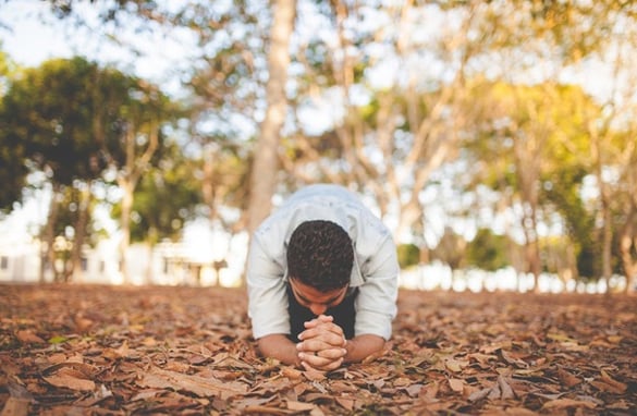 Guy Kneeling in Prayer | Pure Flix